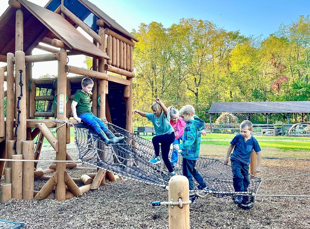 Kids playing on playspace structure